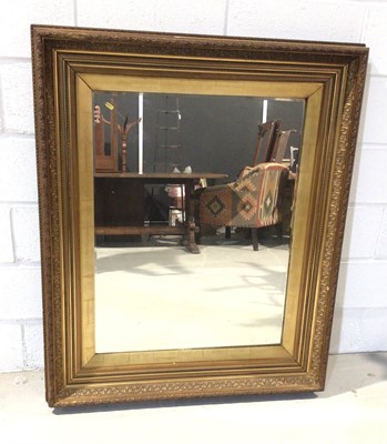 Lot 1013 - Large bevelled wall mirror in ornate gilt frame