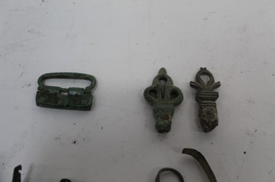 Lot 2356 - Roman and medieval artefacts found in England, to include brooches, bronze key heads, knife handles x 4, crossbow bolts x 2, and other items