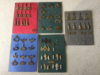 Lot 807 - Five boards each mounted with British military cap badges and shoulder titles