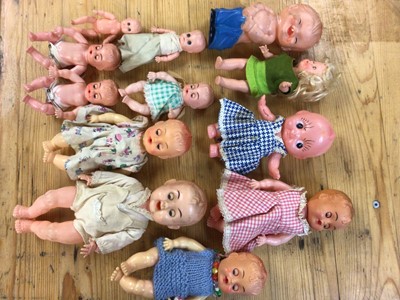 Lot 2430 - A selection of small plastic dolls including two clock-work crawling dolls.