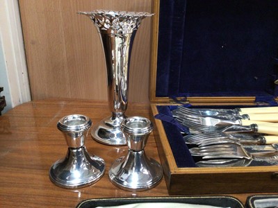 Lot 60 - Silver spill vase, pair of silver candlesticks together with a Viners canteen, other cutlery and plated items