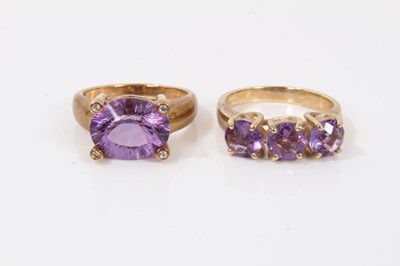 Lot 372 - Two 9ct gold purple stone dress rings
