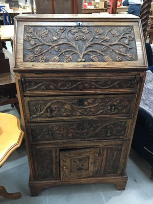 Lot 903 - Late Victorian carved oak bureau with floral carved decoration , Victorian easy chair and occasional table (3)