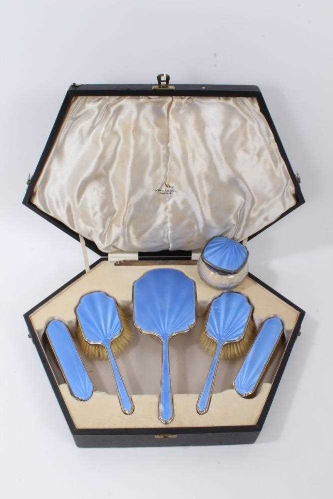 Lot 151 - 1930s Art Deco five piece silver dressing table set, comprising a hand mirror and four brushes with blue guilloche enamel decoration