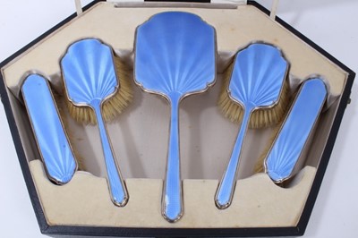 Lot 151 - 1930s Art Deco five piece silver dressing table set, comprising a hand mirror and four brushes with blue guilloche enamel decoration