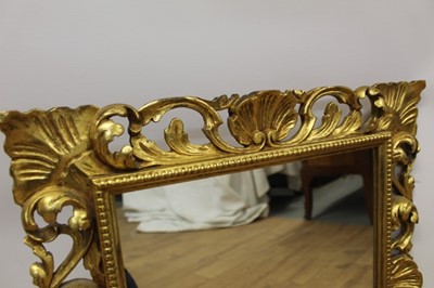 Lot 1485 - Ornate Florentine carved gilt mirror