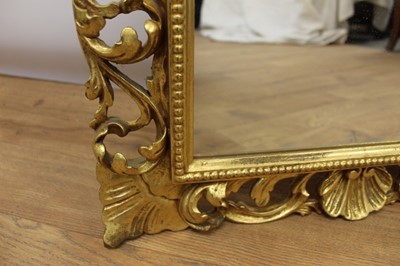 Lot 1485 - Ornate Florentine carved gilt mirror