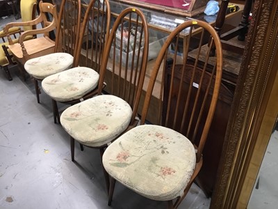 Lot 926 - Ercol elm oval dropleaf table and set four Ercol stick back chairs