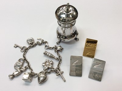 Lot 710 - Two silver pins, one silver gilt pin, silver charm bracelet and silver pepperette