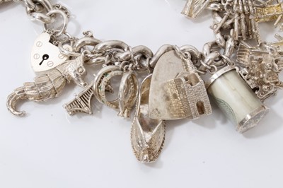 Lot 42 - Silver charm bracelet with large quantity of silver and white metal novelty charms
