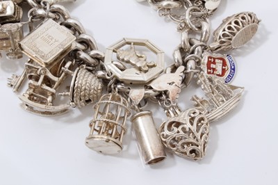 Lot 42 - Silver charm bracelet with large quantity of silver and white metal novelty charms