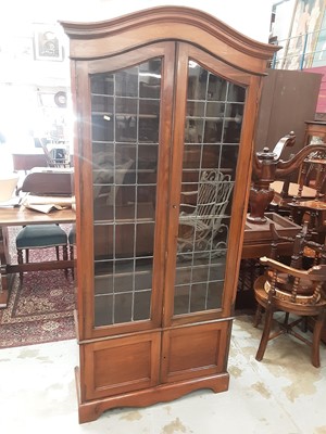 Lot 1021 - Early 20th century walnut dome top bookcase with shelved interior enclosed by two leaded glazed doors, with two panelled doors below, 94cm wide, 33.5cm deep, 200.5cm high
