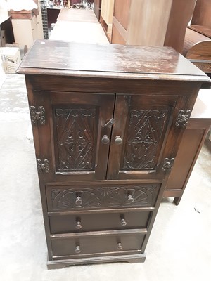 Lot 1023 - Old Oak cupboard with two carved panelled doors and three drawers below, 61cm wide, 36.5cm deep, 120cm high