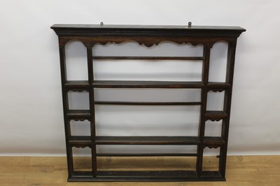 Lot 1386 - George III oak hanging open hanging rack