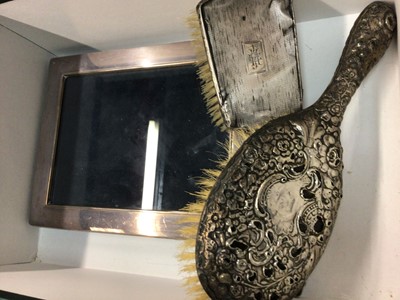 Lot 700 - Silver picture frame and two dressing table brushes