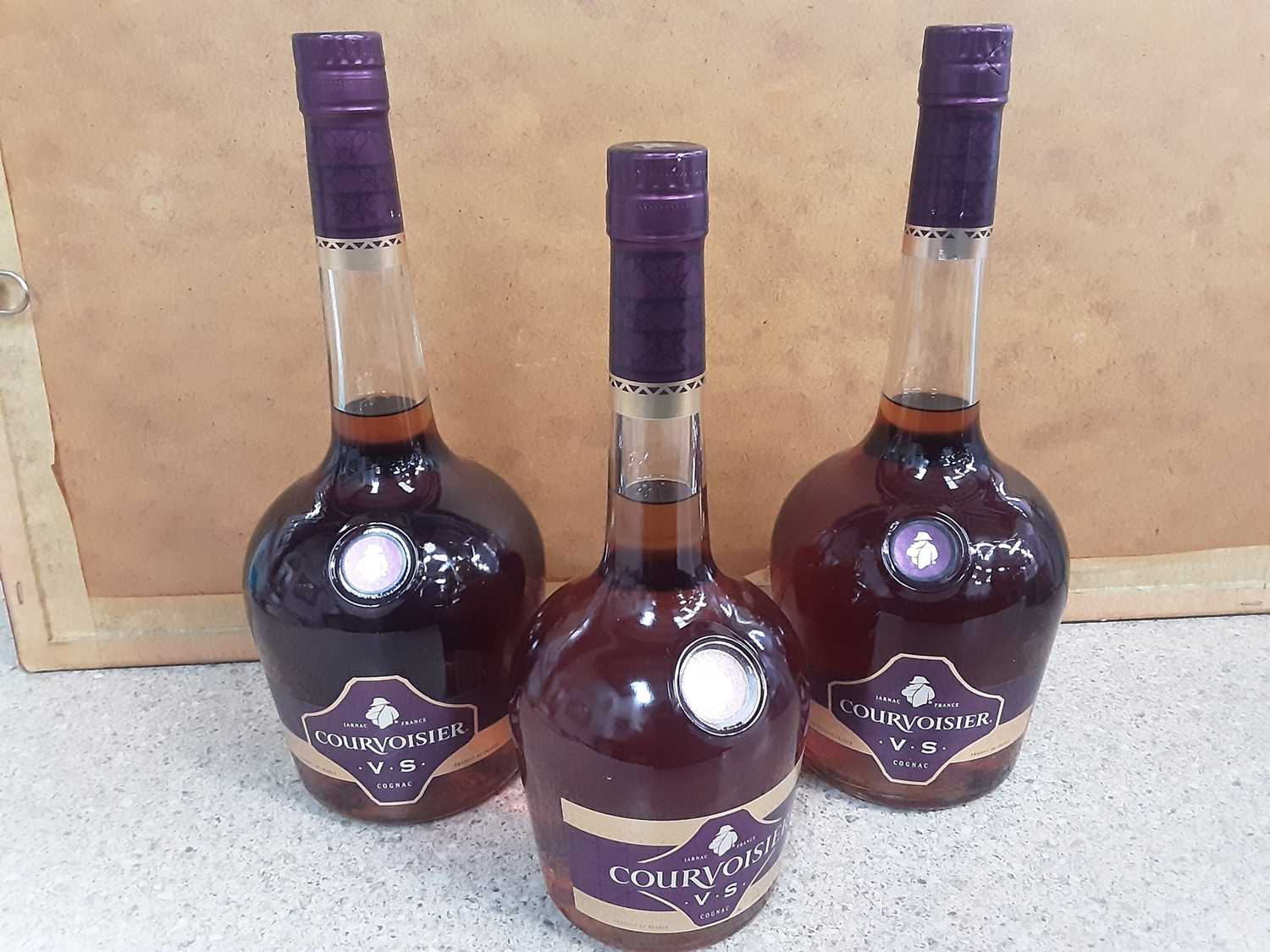 Lot 10 - Two 1 litre bottles of Courvoisier V.S plus another 70cl (3)