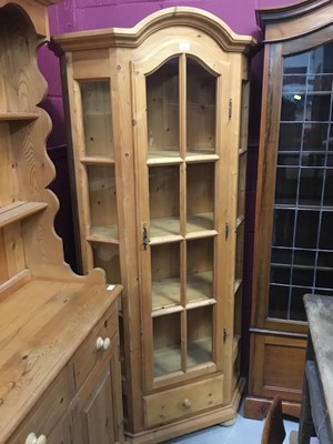 Lot 943 - Pine display cabinet with arched glazed door and four shelves and drawer below on bunn feet 188 cm high