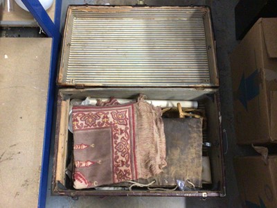 Lot 145 - A vintage trunk containing sundry items, including navy canvas kit bags, two Turkish rugs, etc