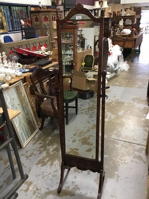 Lot 963 - 1930s walnut cheval mirror with shell cresting silver on splayed end standards