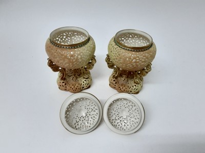 Lot 1161 - Pair of Royal Worcester Blush Ivory reticulated Pot Pourri vases and covers