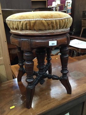 Lot 969 - Edwardian carved walnut revolving piano stool with turned supports