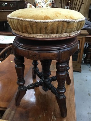 Lot 969 - Edwardian carved walnut revolving piano stool with turned supports