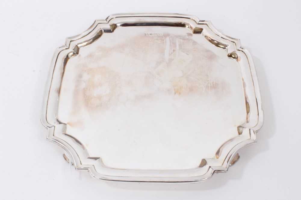 Lot 145 - Contemporary silver salver of square form, raised on four feet, Sheffield 1979, maker Poston Products Ltd