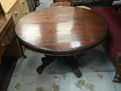 Lot 1027 - Victorian oak oval  breakfast table with extending top and extra leaf on ornate base with dragon mask mounts