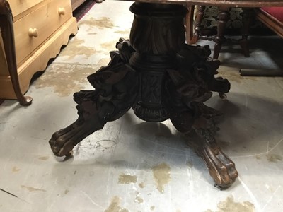 Lot 1027 - Victorian oak oval  breakfast table with extending top and extra leaf on ornate base with dragon mask mounts