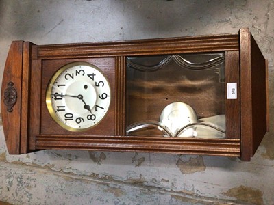 Lot 546 - 1930's wall clock with eight day striking movement, bevelled glazed oak case, pendulum and key