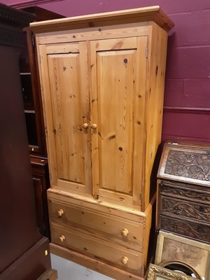 Lot 1082 - Victorian style pine wardrobe with two panelled doors enclosing hanging rail, and two drawers below, 95cm wide, 48cm deep, 196cm high