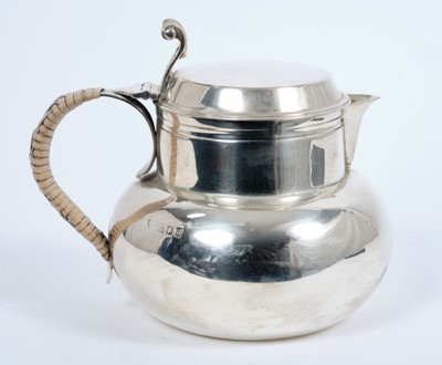 Lot 344 - George V silver hot water jug of compressed baluster form