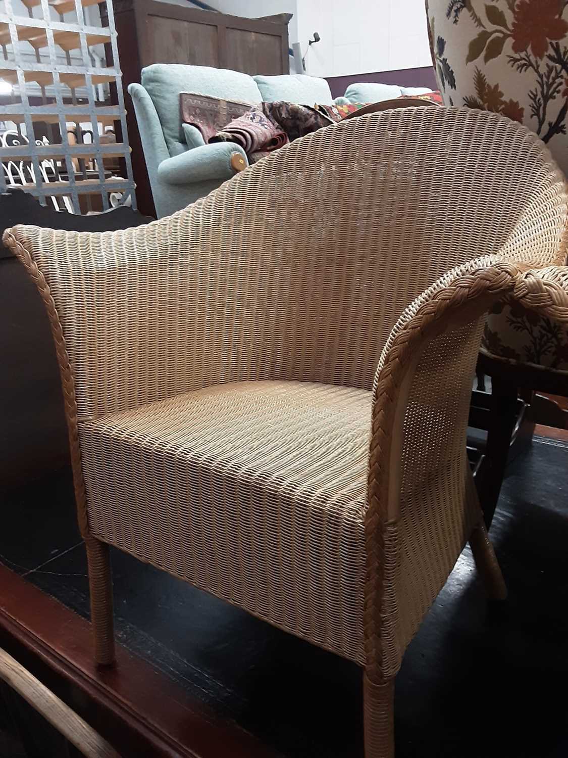 Lot 1103 - Set of four good quality Lloyd Loom Eastward wicker chairs and a matching coffee table (5)