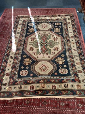 Lot 1108 - Eastern rug with geometric decoration on blue, red and cream ground, 204cm x 145cm