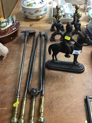 Lot 406 - Victorian cast iron military figure door stop, pair brass and iron fire dogs and fire implements