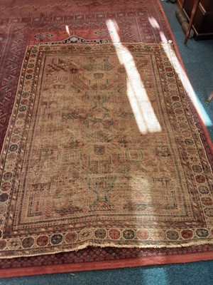 Lot 1109 - Eastern rug with geometric decoration on red, blue, and beige ground, 188cm x 142, plus another similar rug