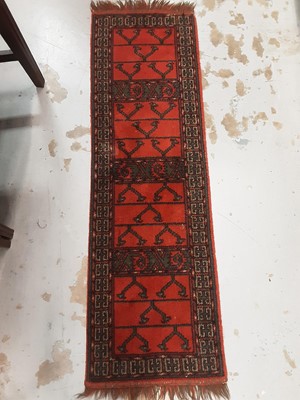 Lot 1110 - Eastern rug with geometric decoration on red and blue ground, 131cm x 80cm and one other runner, 127cm x 38.5cm
