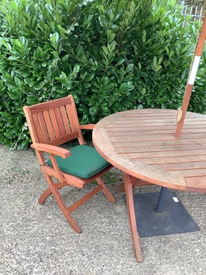 Lot 899 - Garden set comprising folding table, four matching chairs with cushions, parasol and stand