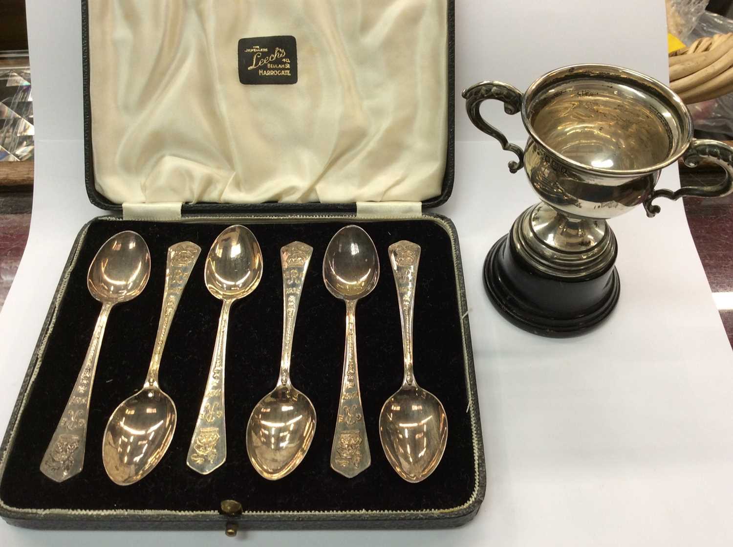 Lot 730 - Set six silver Royal Commemorative teaspoons in fitted case and small silver two handled trophy on stand