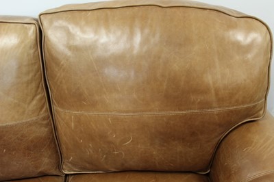 Lot 1392 - Modern tan leather three seater sofa
