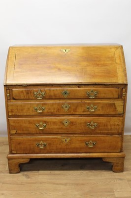 Lot 1434 - George III cherrywood and elm bureau