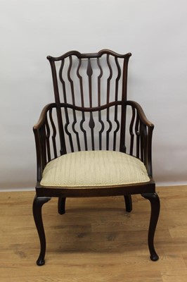 Lot 1451 - Arts and Crafts mahogany wavy stick back open armchair