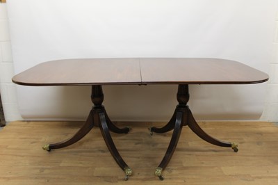 Lot 1438 - Regency style mahogany twin pedestal extending dining table