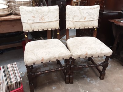 Lot 1138 - Set of four oak dining chairs with studded cream upholstered seats and backs on turned and block legs joined by turned strecher