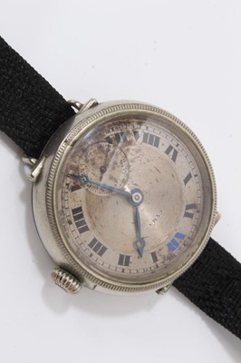 Lot 162 - First World War Officers Cyma trench wristwatch together with another similar and a compass on brown leather strap (3)