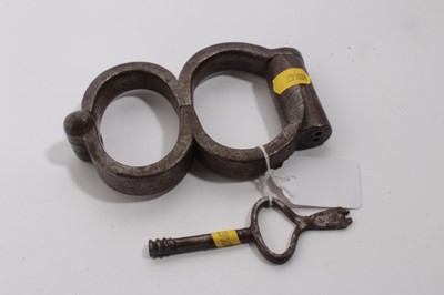 Lot 905 - Pair of Edwardian steel figure of eight hand cuffs stamped Hiatt, Birmingham M&C 1901, together with key