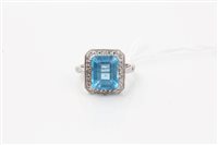 Lot 1613 - Blue topaz and diamond ring with central...