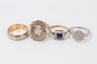 Lot 180 - 9ct white gold diamond cluster ring, 9ct gold synthetic sapphire and white stone cluster ring, 9ct gold smoky quartz dress ring and a two-colour gold wedding ring.