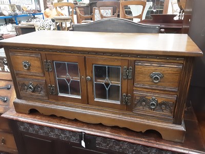 Lot 1161 - Old Charm carved oak sideboard with three drawers and cupboards below, 152.5cm wide, 44.5cm deep, 81.5cm high