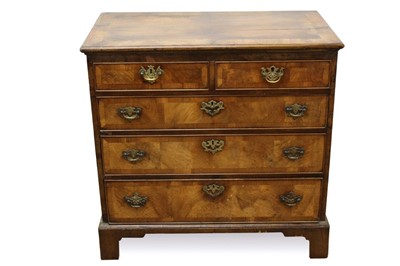 Lot 1454 - George I walnut veneered chest of two short snd three long drawers with crossbanded decoration and brass handles on bracket feet